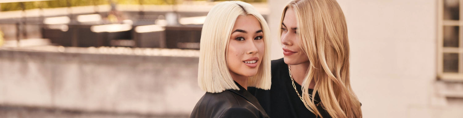 two women with bright, radiant blonde hair